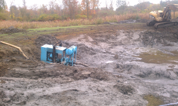 using a small pump to dredge a pond
