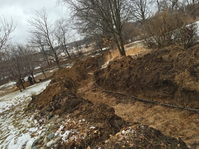 Davisburg, Michigan new pond boulder wall install (19).jpg
