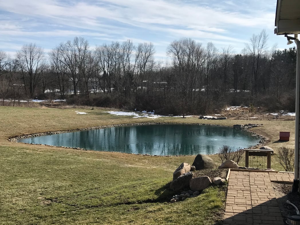 Holly, Michigan Placing rocks around pond (36)