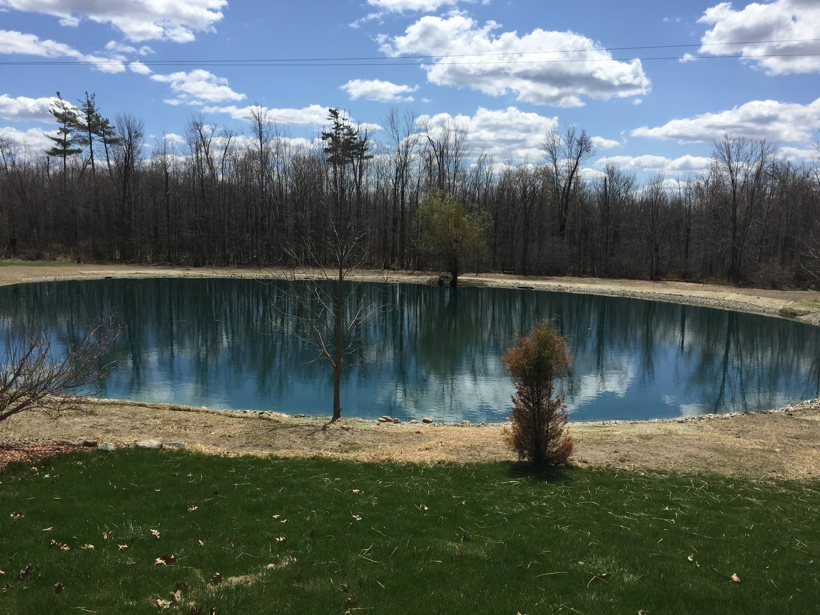 Rocks around pond fix pond banks Metamora, MI pond erosion
