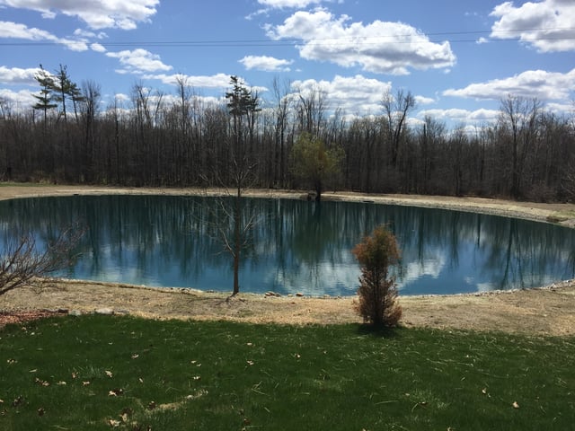 Rocks_around_pond_fix_pond_banks_Metamora_MI.jpg