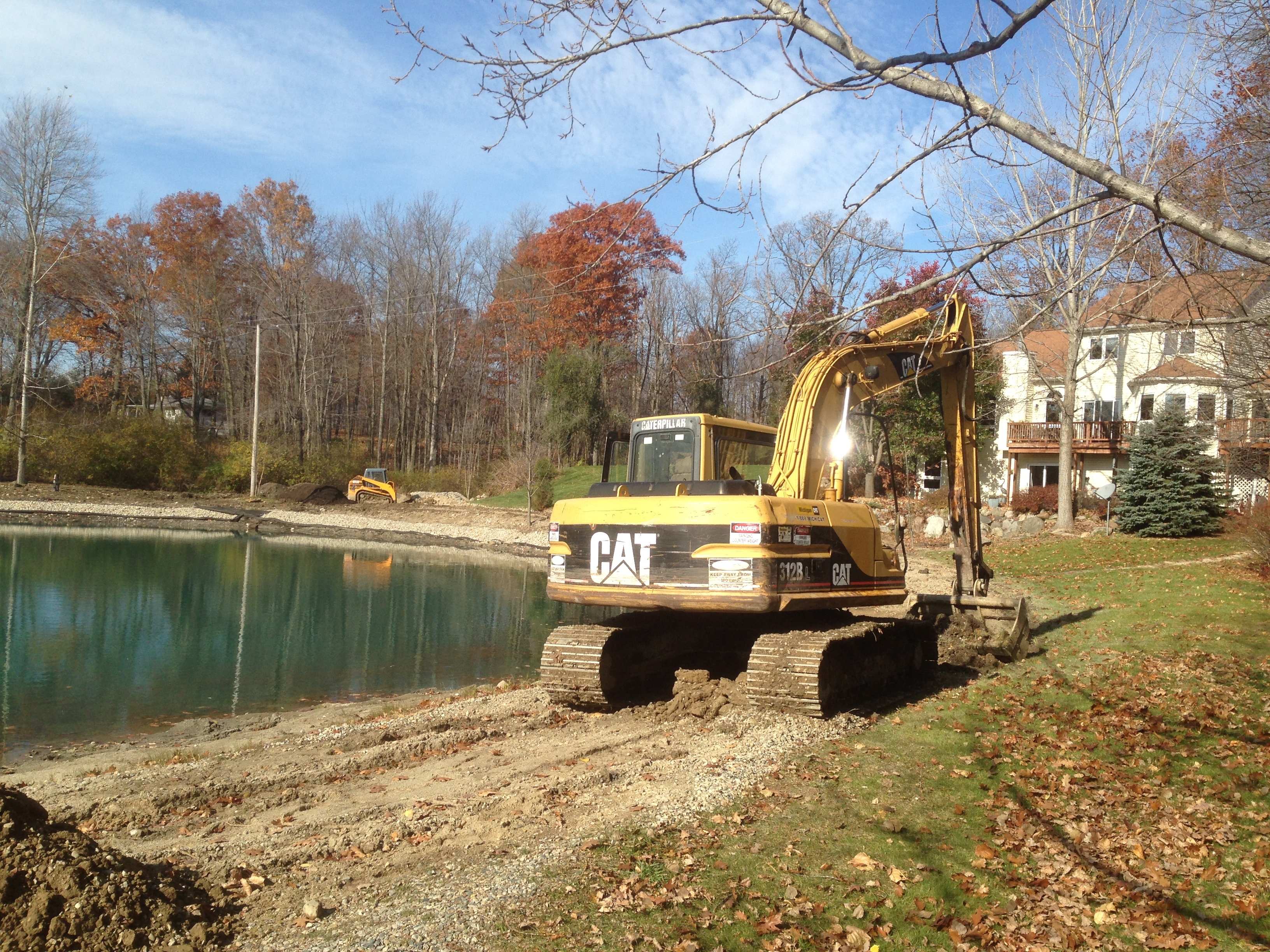 Rocks_around_pond_fix_pond_banks_Metamora_MI_25.jpg